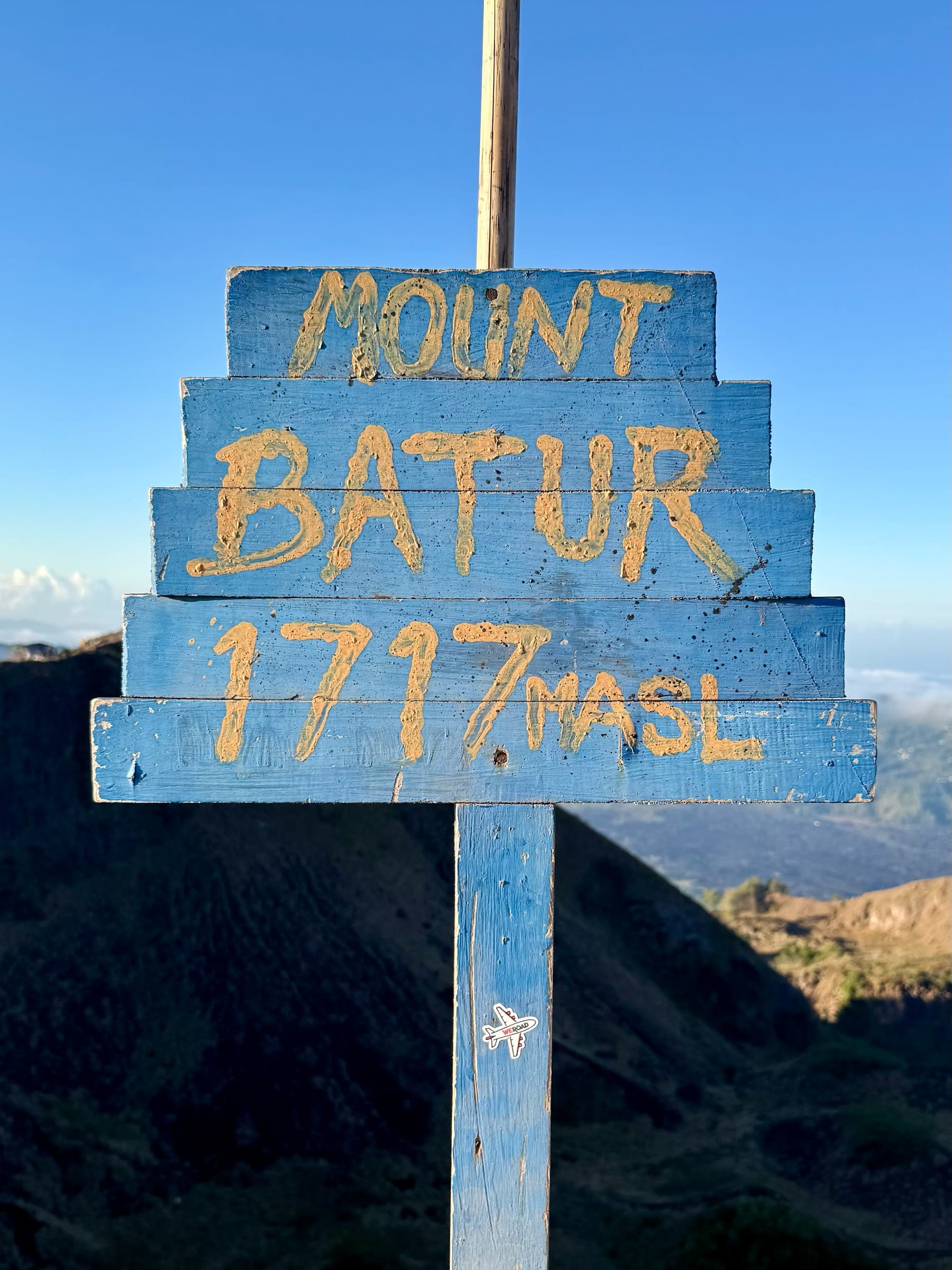 The hand-painted summit sign reading Mount Batur, 1717 metres above sea level